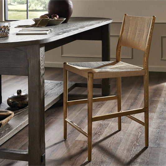 Dara Bar Stool by Four Hands in toasted ash, natural paper cord. Made from rush, solid ash in a rustic style.