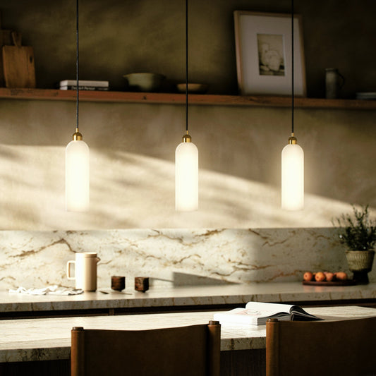 Odyssey Single Pendant by Four Hands in opal matte glass, black cord, burnished brass and opal matte glass. Made from glass, thermoplastic, brass in a modern style.