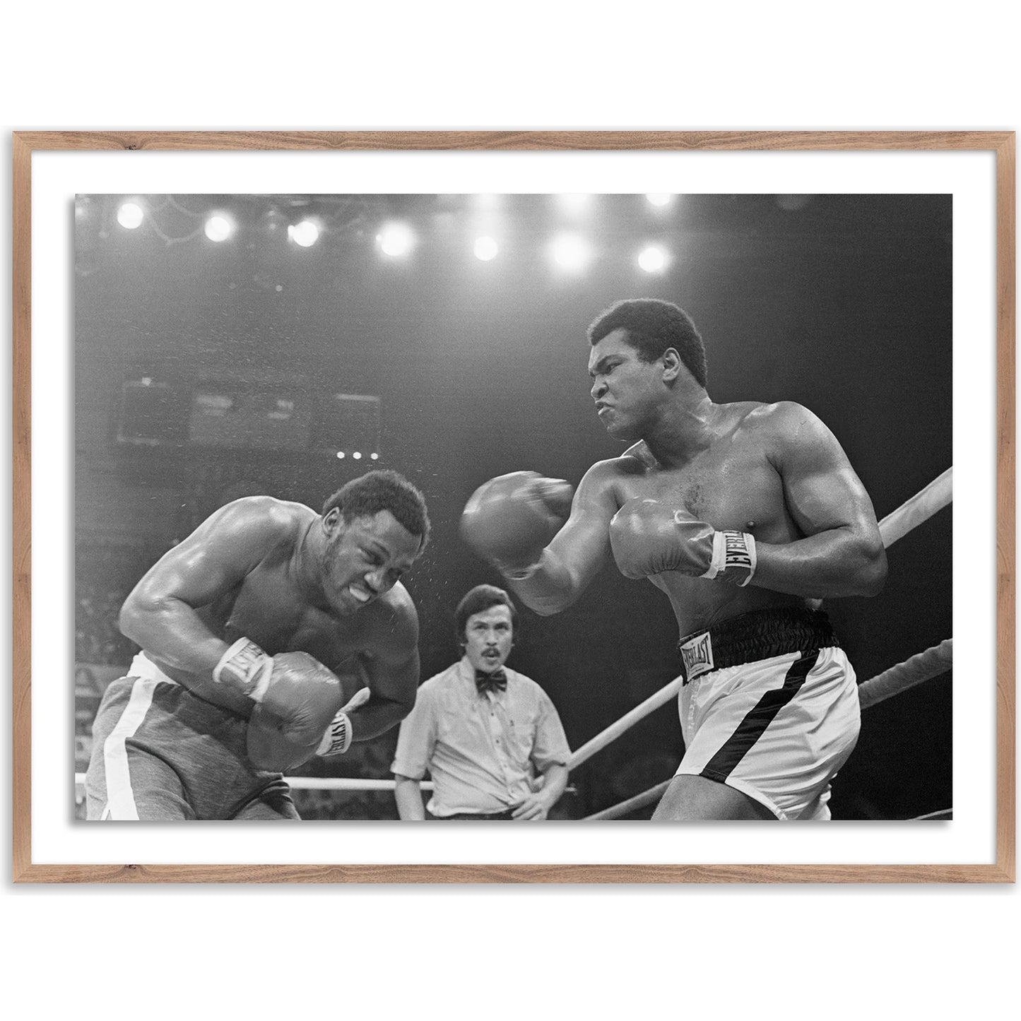 003 SI-2092886 | Additional Silo | Muhammad Ali Punching Joe Frazier by Getty Images by Four Hands. Made from unique in a modern style.