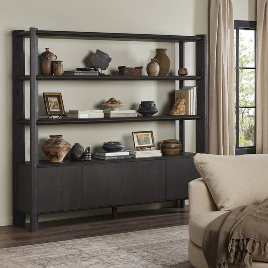 Orwin Wide Bookshelf by Four Hands in smoked black oak, smoked black oak veneer. Made from solid oak, thick oak veneer in a transitional style.