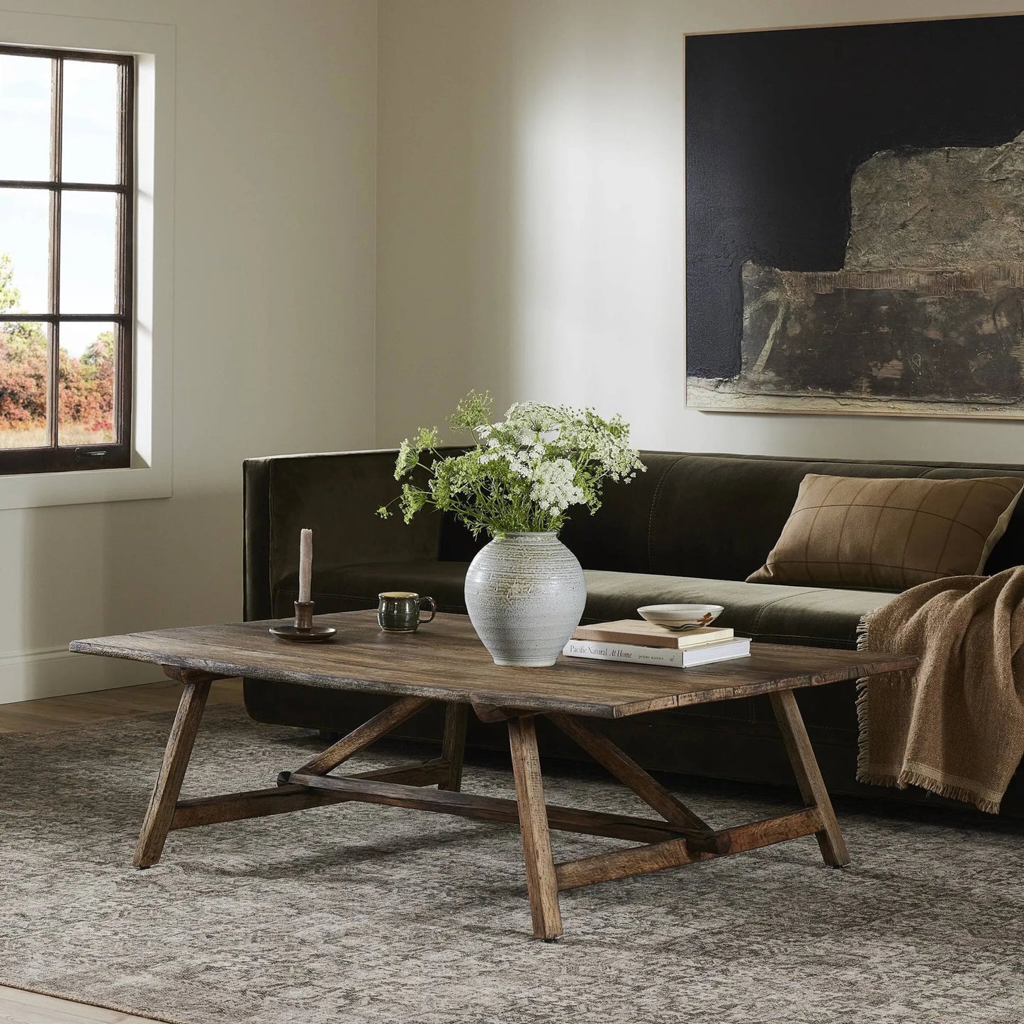 010 SI-2327555 | Lifestyle | Elio Coffee Table Small by Four Hands in burnt bleached oak. Made from solid oak in a transitional style.