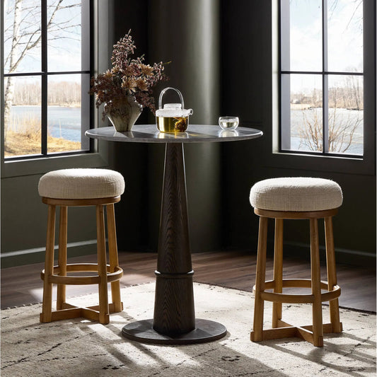 Staria Swivel Stool by Four Hands in saxon sand, warm oak. Made from 58% polyester, 39% wool, 3% cotton, solid oak in a transitional style.