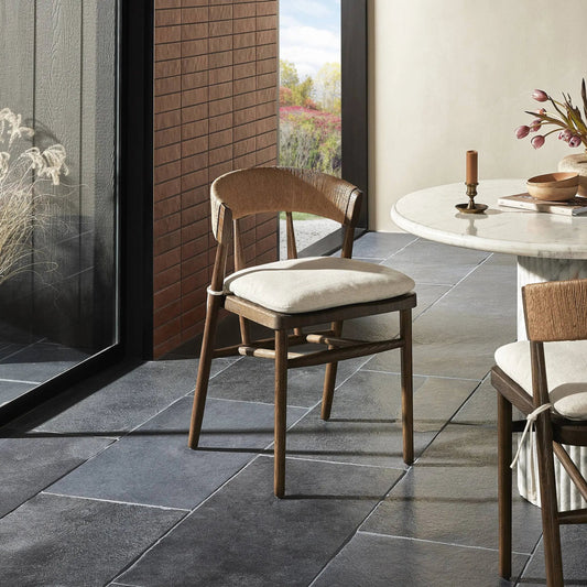 Buxton Dining Chair with Cushion by Four Hands in savile flax, drifted oak, natural paper rush. Made from 92% polyester, 8% flax/linen, solid oak, rush in a rustic style.