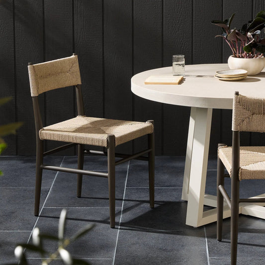 Lomas Outdoor Metal Dining Chair by Four Hands in textured dune, bronze. Made from 100% polyethylene, iron in a transitional style.