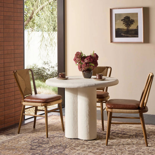 Grano Bistro Table by Four Hands in plaster molded concrete. Made from solid concrete in a unique style.