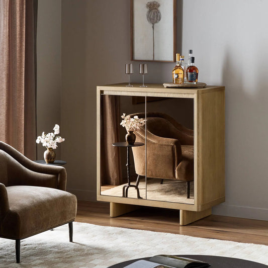 Reneen Bar Cabinet by Four Hands in blonde oak, blonde oak veneer, warm grey mirror. Made from solid oak, oak veneer, mirror in a transitional style.