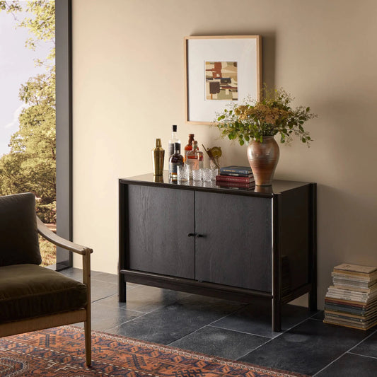 Vinco Sideboard by Four Hands in black onyx lacquer, oil rubbed bronze. Made from engineered hardwood, iron in a traditional style.