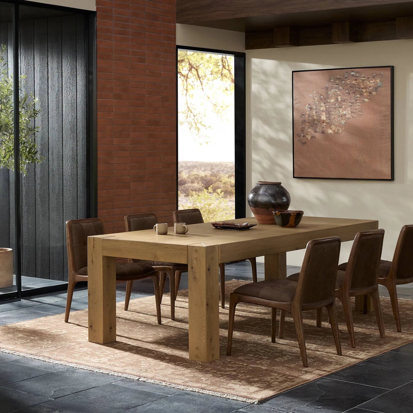 011 SI-2446545 | Lifestyle | Emmer Dining Table by Four Hands in aged smoked oak, aged smoked oak veneer. Made from solid oak, thick oak veneer in a transitional style.