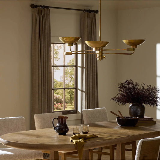 Lund Chandelier by Four Hands in burnt brass. Made from brass in a modern style.