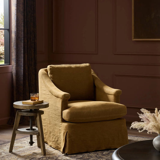 Joplin Swivel Chair by Four Hands in broadway gilt. Made from 100% flax/linen in a transitional style.