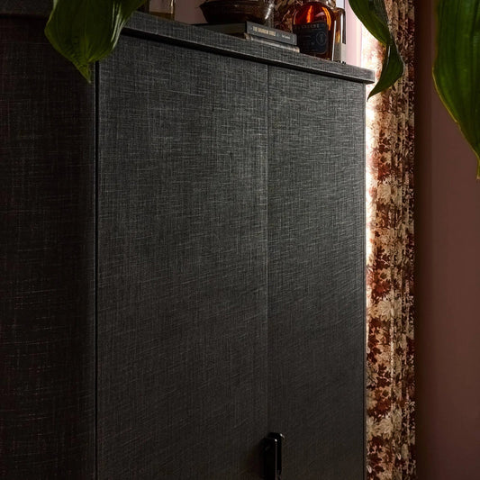 Berlin Cabinet by Four Hands in black linen, black mahogany veneer. Made from painted linen, mahogany veneer in a transitional style.