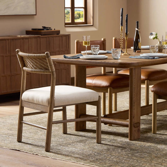 Raynor Dining Chair by Four Hands in lynchart sand, natural mindi, natural agel. Made from 85% polyester, 15% flax/linen, solid mindi, sugar palm in a unique style.