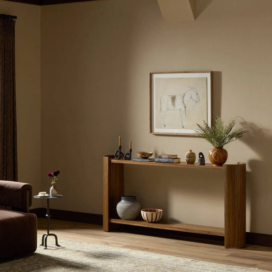 Damari Console Table by Four Hands in medium brown limba. Made from limba veneer in a unique style.