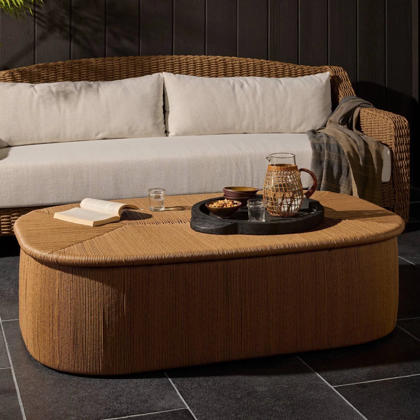011 SI-2531711 | Lifestyle | Taum Outdoor Coffee Table by Four Hands in textured sand. Made from 100% polyethylene in a unique style.