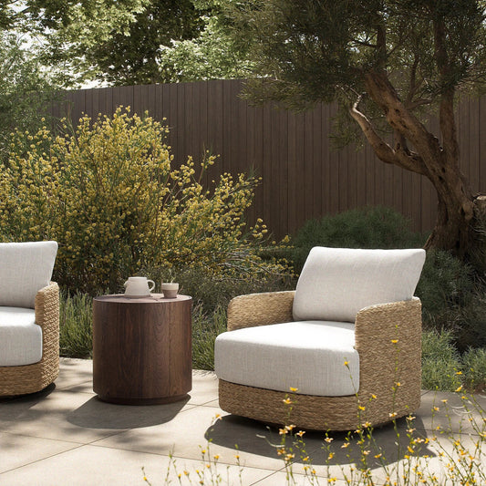 Caney Outdoor Swivel Chair by Four Hands in coastal weave, vergo cream. Made from 100% polyethylene, 100% polyester in a unique style.