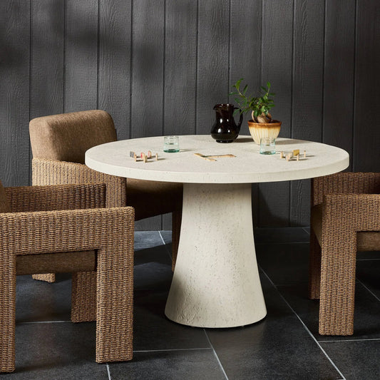Varda Outdoor Dining Table by Four Hands in coarse ivory concrete. Made from solid concrete in a unique style.
