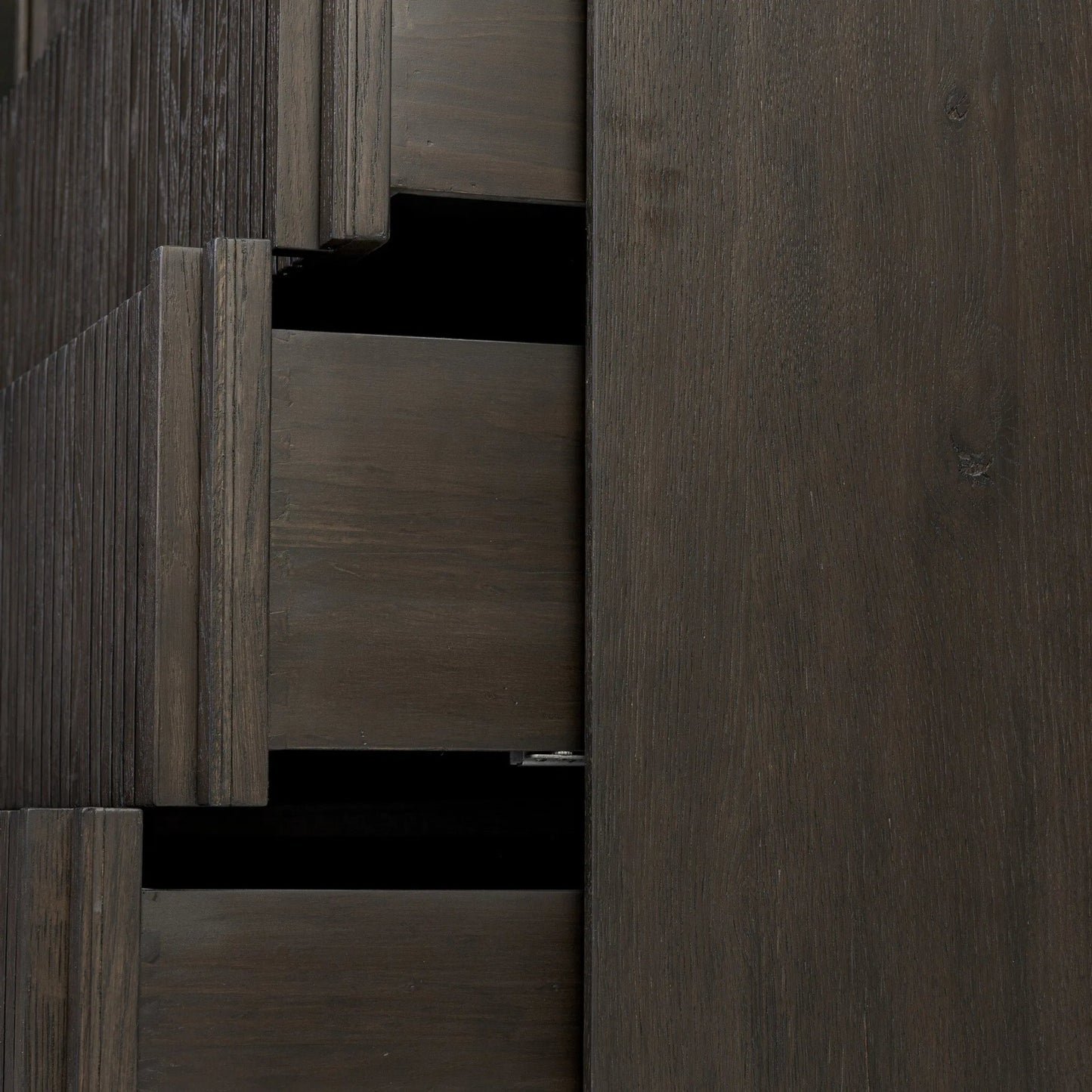 012 SI-2535198 | Closeup | Leo 5-Drawer Dresser by Four Hands in smoked black veneer. Made from thick oak veneer, solid oak in a unique style.