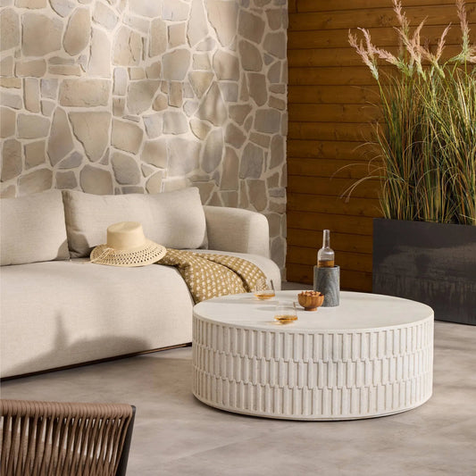 Callisto Outdoor Coffee Table by Four Hands in aged white concrete. Made from solid concrete in a unique style.