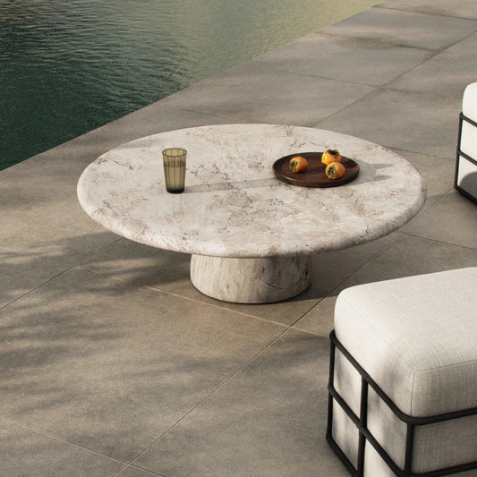 Cornelia Outdoor Coffee Table by Four Hands in natural veined concrete. Made from solid concrete in a unique style.