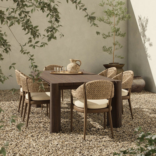Soho Outdoor Dining Table by Four Hands in stained saddle brown. Made from solid teak in a unique style.