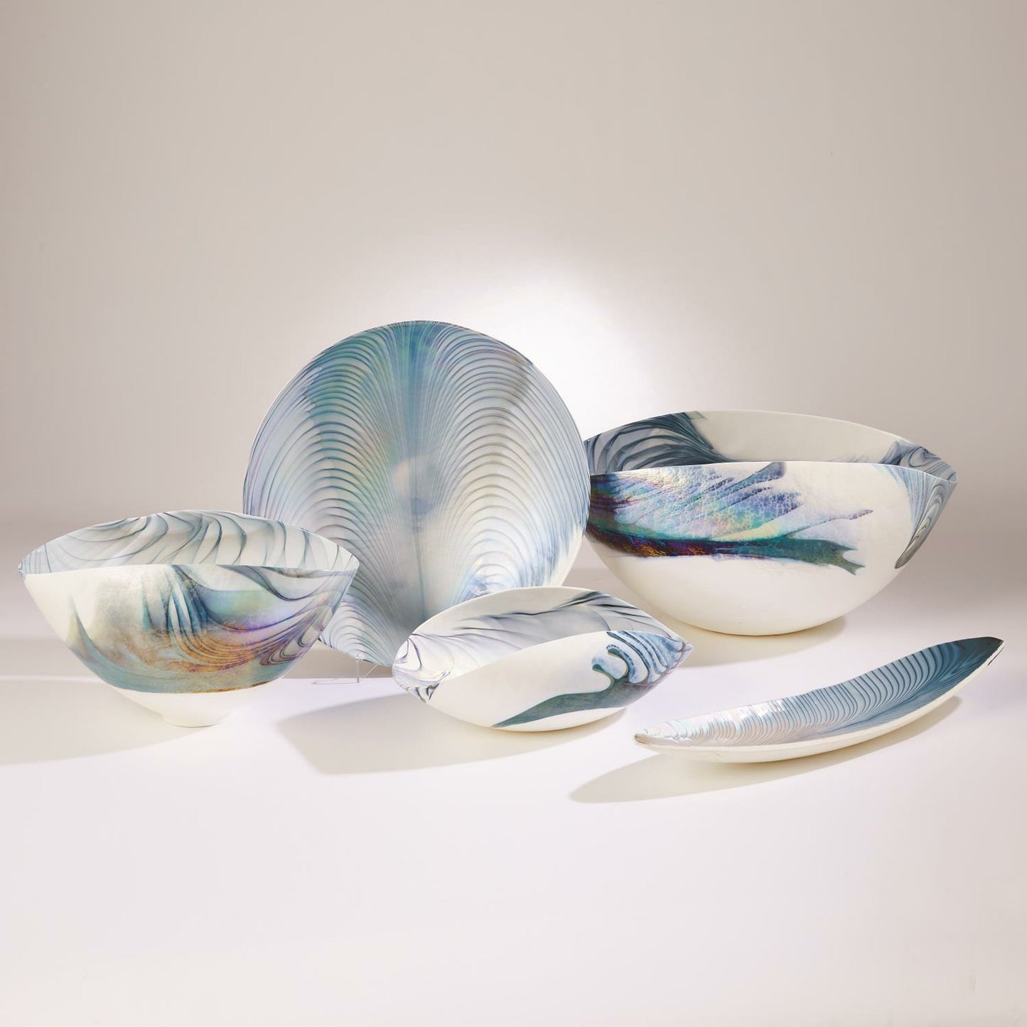 002 SR-892295 | Additional Silo | Ivory Turquoise Feather Swirl Oval Folded Bowl by Global Views. Made from art glass in a coastal style.