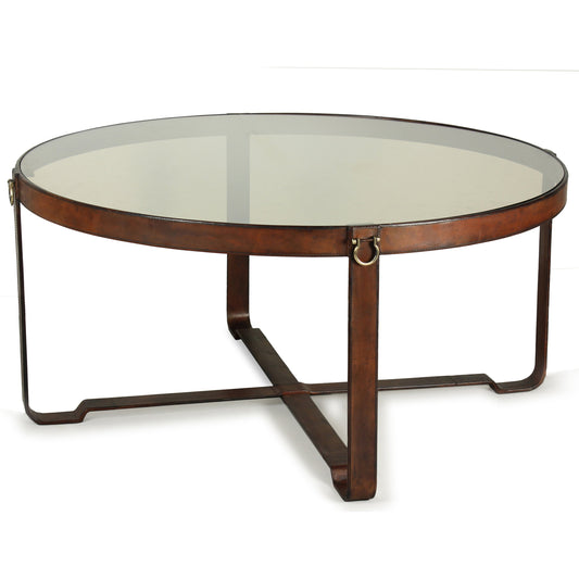 Harness Round Coffee Table by Sarreid Ltd. in brown, clear and smoke glass; brass handles. Made from leather, glass, iron in a modern style.