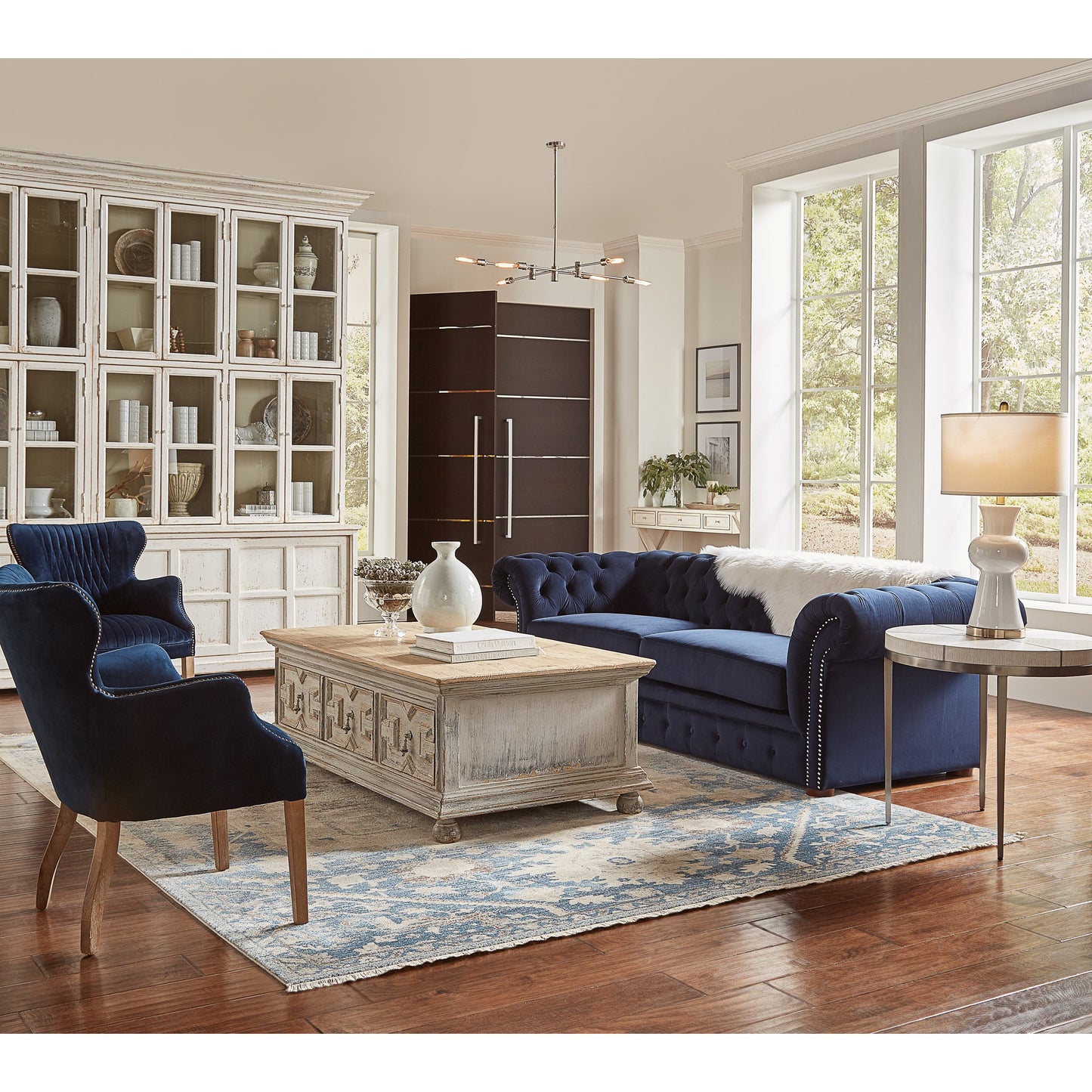 006 SR-857734 | Lifestyle | Glass Front Bookcase by Sarreid Ltd. in white and shelves 8 fixed & 2 removable. Made from pine, glass in a cottage & farmhouse style.