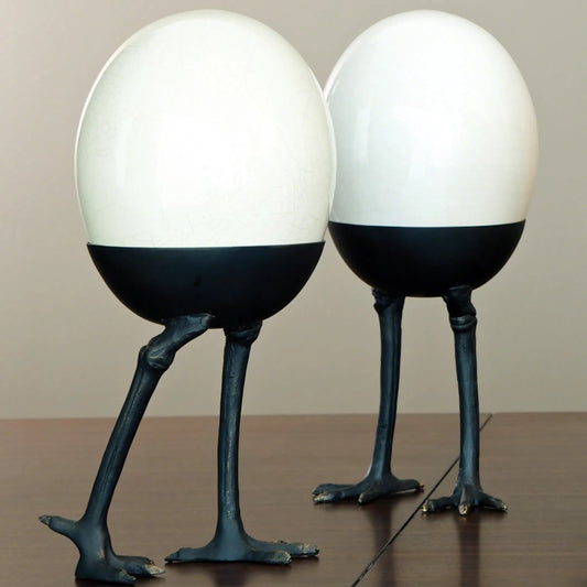 Ivory Crackle Egg by Global Views. Made from ceramic in a modern style.