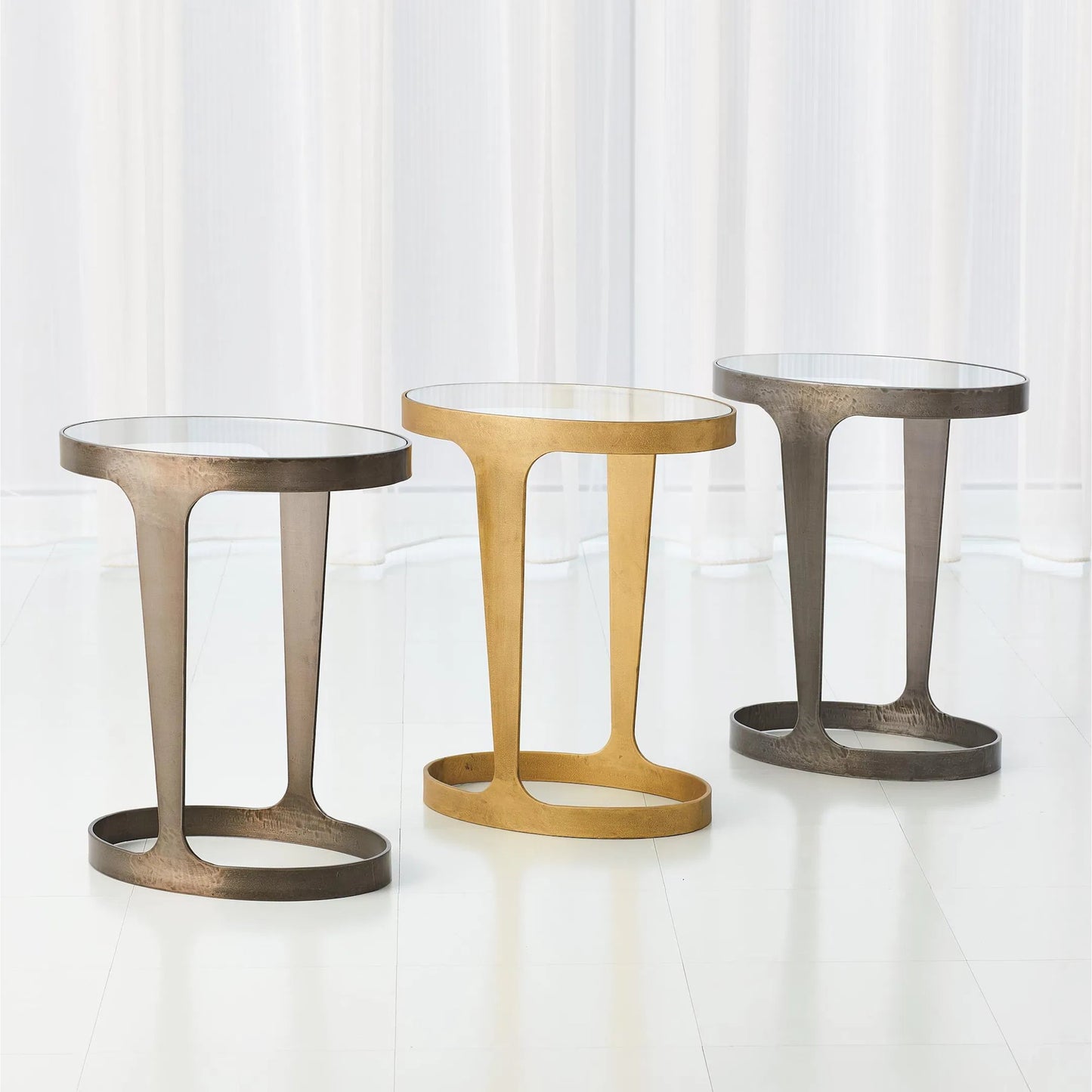 003 SR-701786 | Additional Silo | Oslo Accent Table by Global Views in gold. Made from iron, tempered glass in a eclectic & global style.