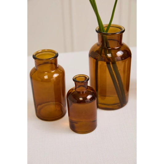 Amber Billie Bottle by Accent Decor in amber. Made from glass in a unique style.