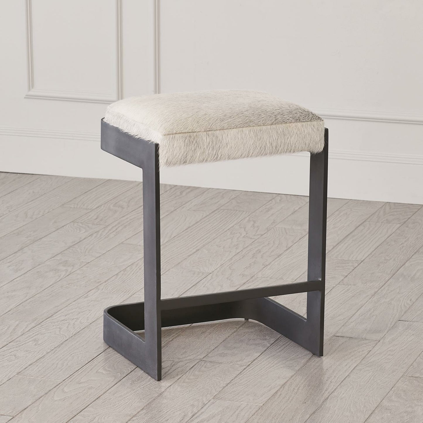 002 SR-892916 | Lifestyle | Regan Low Bar Stool with Grey Hair by Global Views. Made from iron in a modern style.