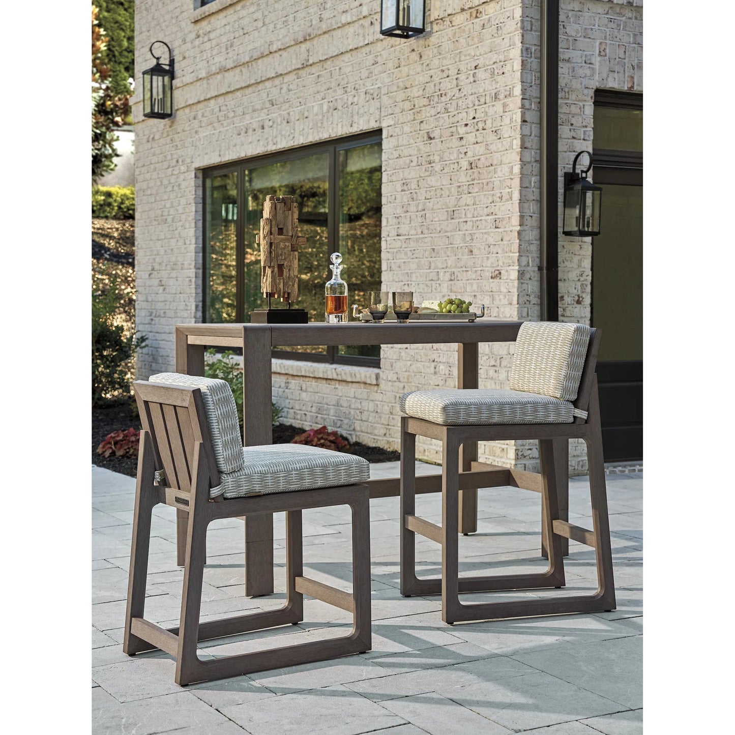 003 SI-2242639 | Lifestyle | Mozambique Bar Stool by Tommy Bahama Outdoor in taupe gray. Made from unique in a modern style.