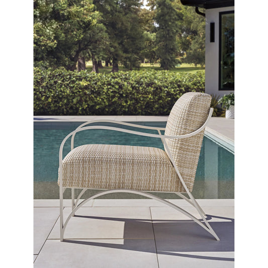 Sand Dune Arm Chair by Tommy Bahama Outdoor in tan and white. Made from all-weather wicker, aluminum in a unique style.