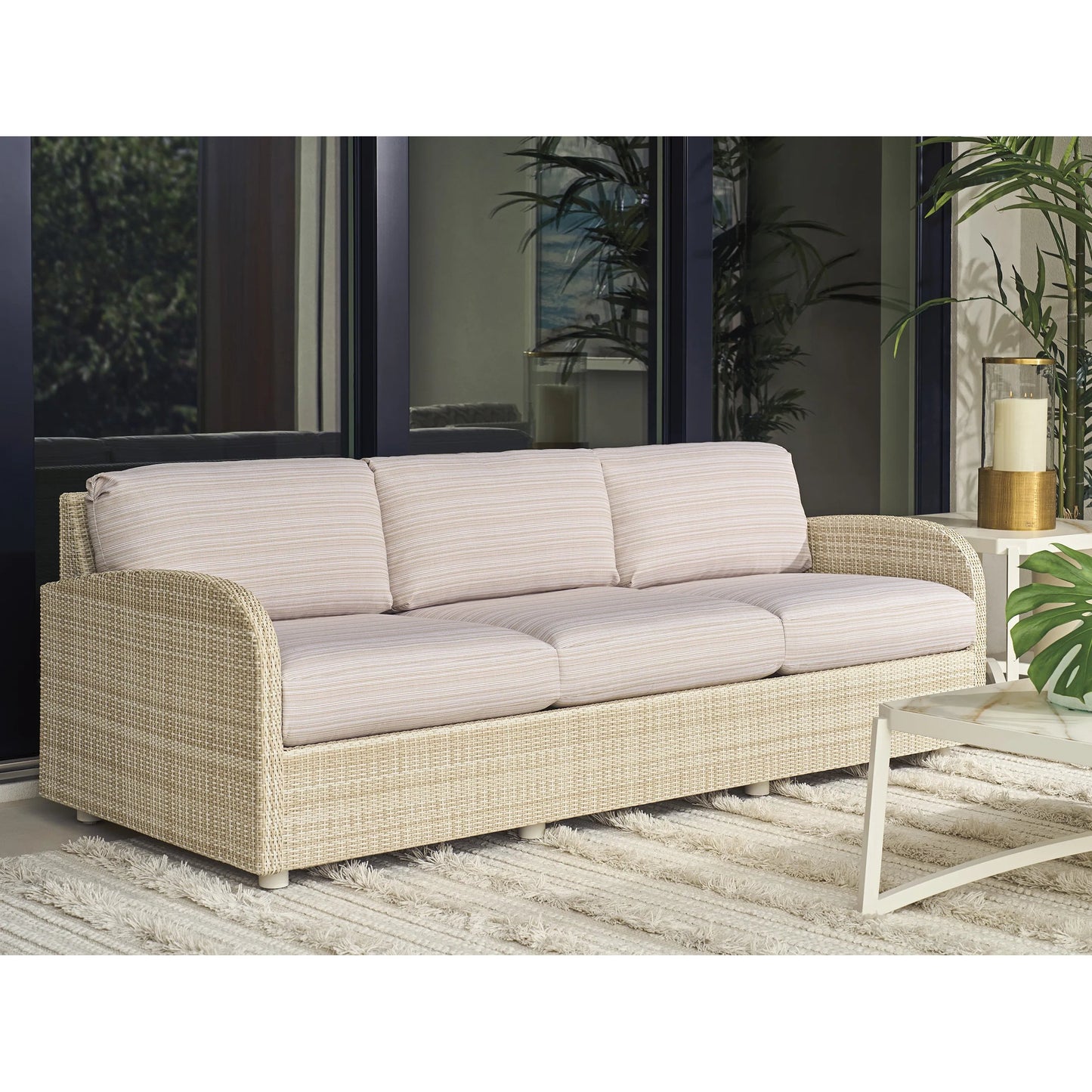 004 SI-2540664 | Lifestyle | Sand Dune Sofa by Tommy Bahama Outdoor in tan and tan. Made from all-weather wicker in a unique style.