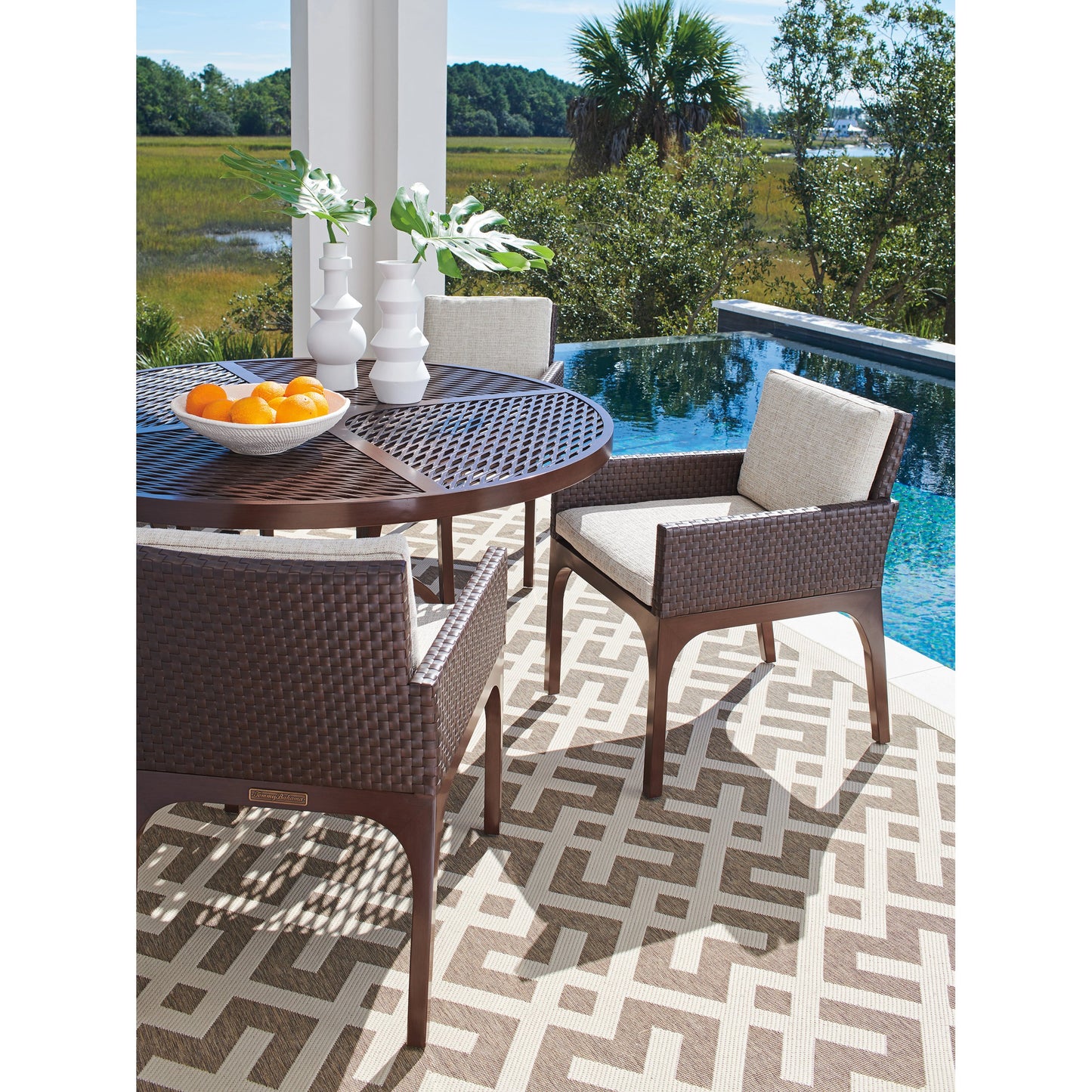 004 SI-1962917 | Lifestyle | Abaco Arm Dining Chair by Tommy Bahama Outdoor in english walnut. Made from unique in a transitional style.