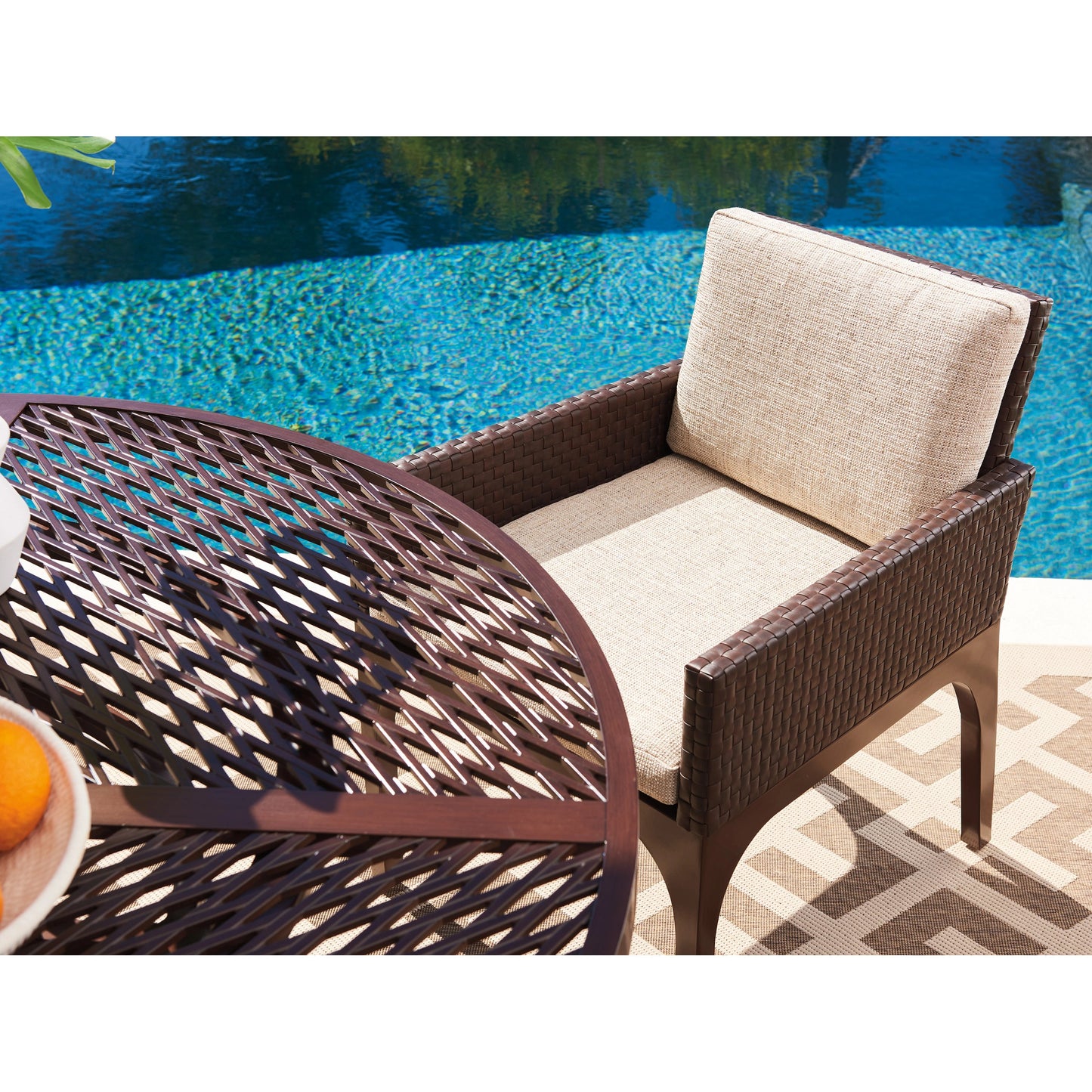 005 SI-1962917 | Lifestyle | Abaco Arm Dining Chair by Tommy Bahama Outdoor in english walnut. Made from unique in a transitional style.