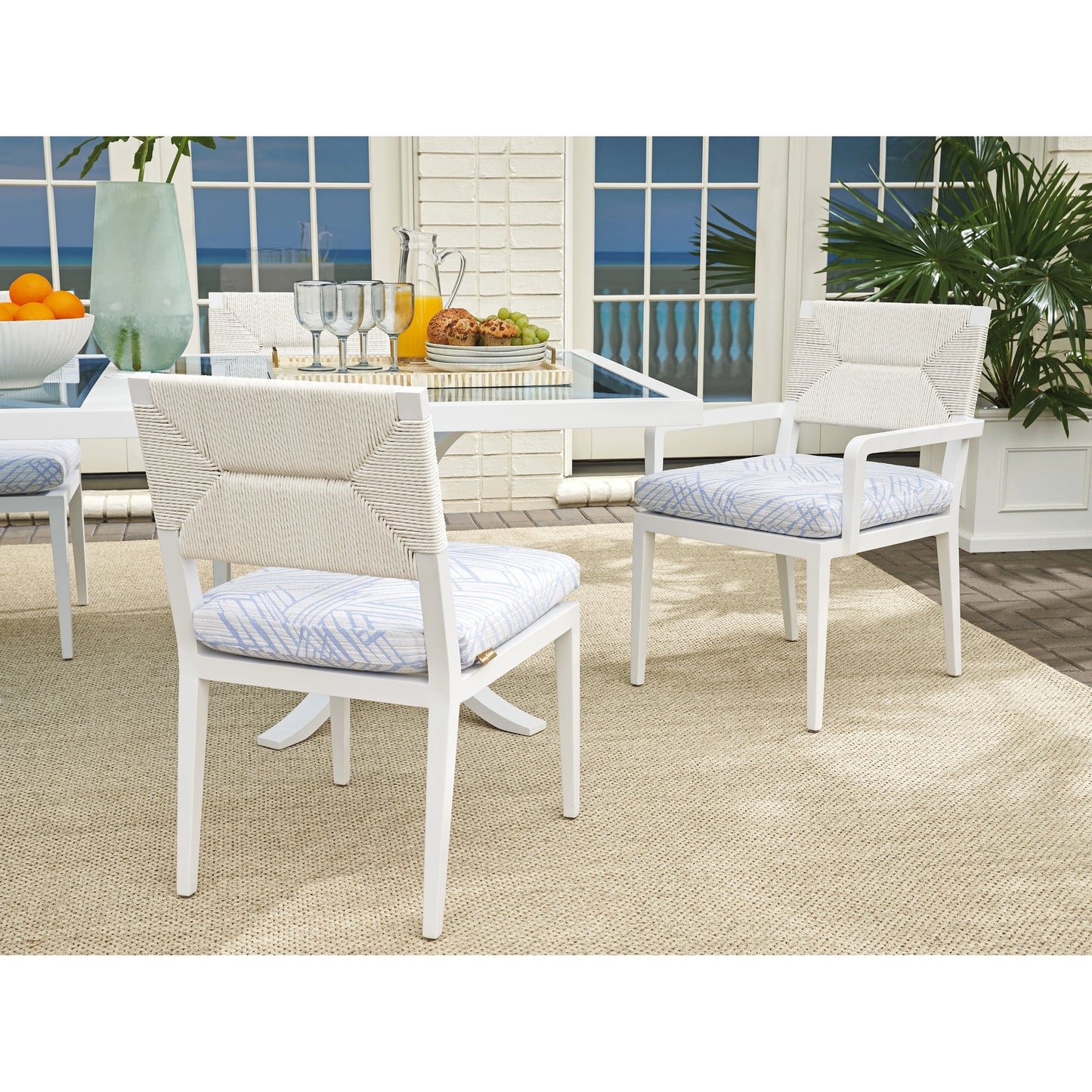 003 SI-2013316 | Lifestyle | Ocean Breeze Promenade Arm Dining Chair by Tommy Bahama Outdoor in pearl white. Made from unique in a modern style.