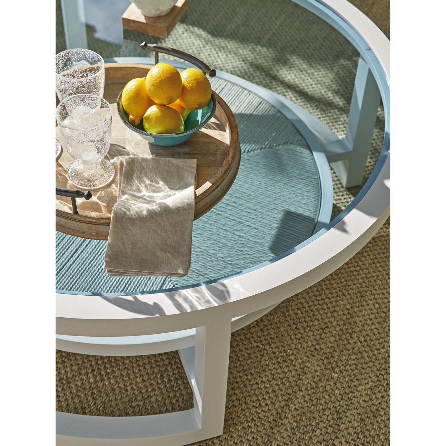 003 SI-2013331 | Closeup | Ocean Breeze Promenade Round Cocktail Table by Tommy Bahama Outdoor in white. Made from unique in a coastal style.