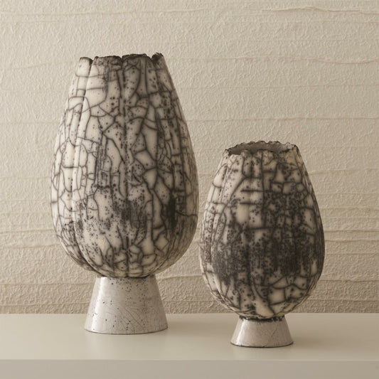 Crackled Footed Vase by Global Views in black raku. Made from ceramic in a modern style.
