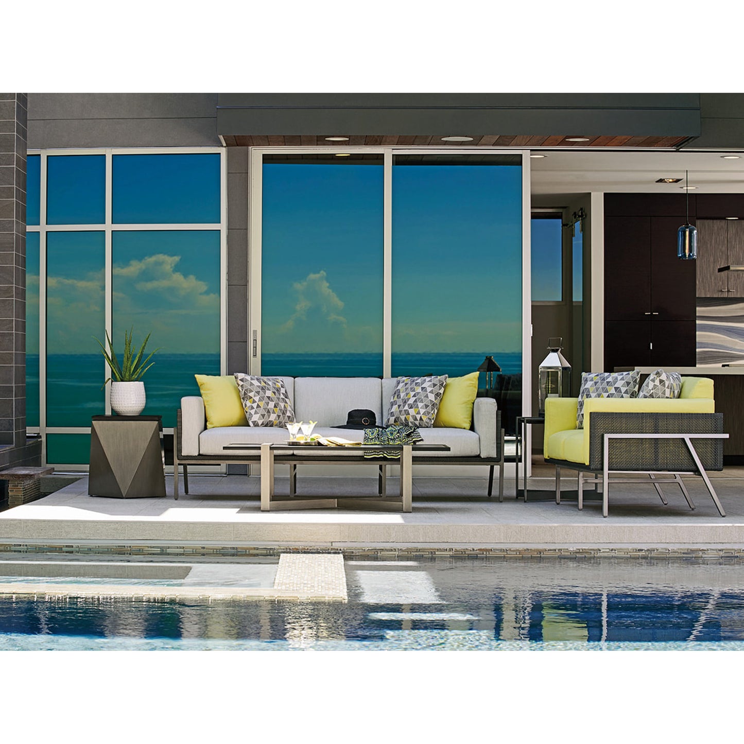 007 SR-836730 | Lifestyle | Del Mar Rectangular Cocktail Table by Tommy Bahama Outdoor in platinum gray. Made from unique in a modern style.