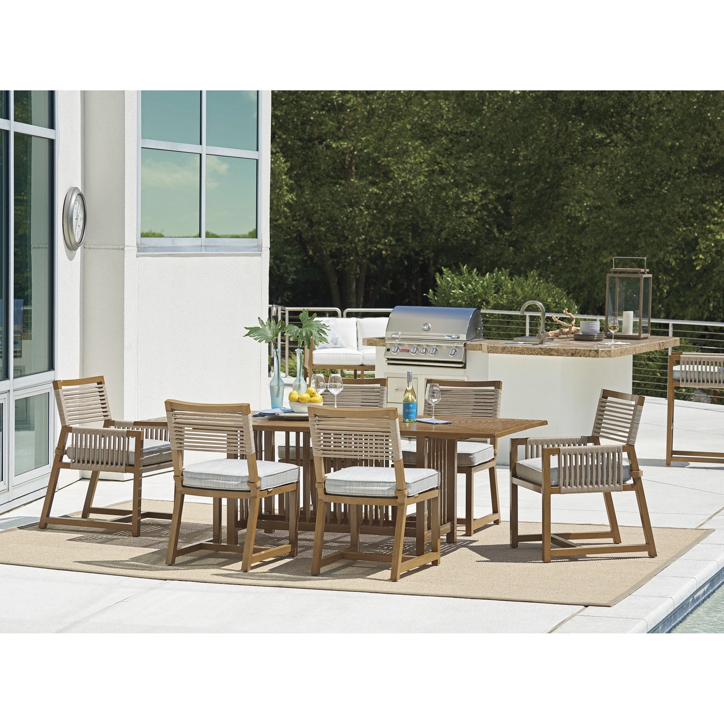 004 SR-836580 | Lifestyle | Cypress Point Ocean Terrace Arm Dining Chair by Tommy Bahama Outdoor in blue. Made from unique in a coastal style.