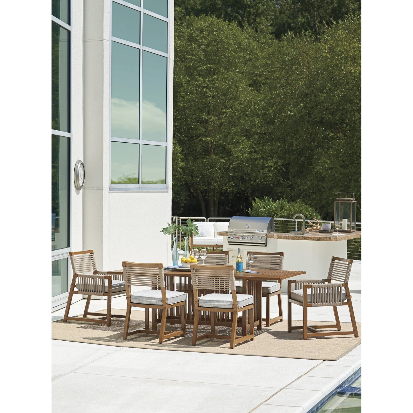 005 SR-836580 | Lifestyle | Cypress Point Ocean Terrace Arm Dining Chair by Tommy Bahama Outdoor in blue. Made from unique in a coastal style.