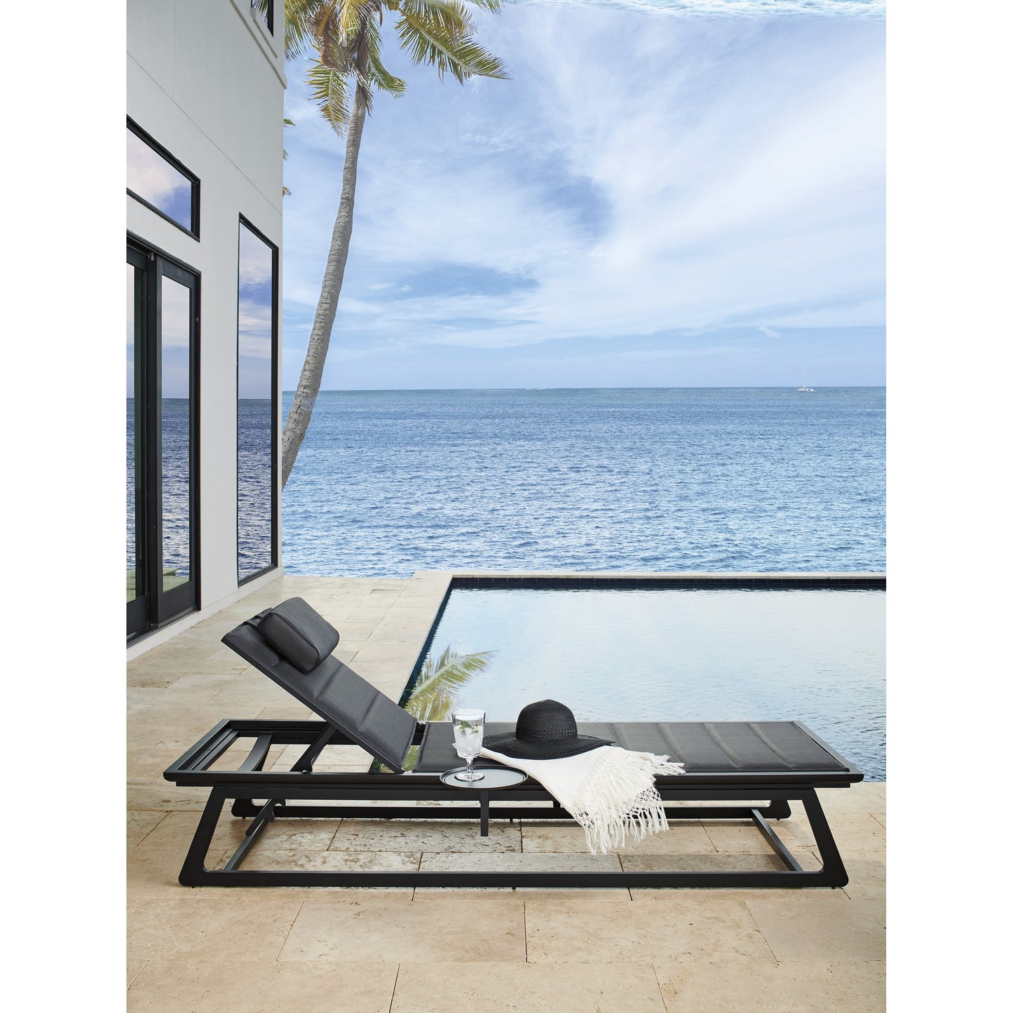 015 SR-836618 | Lifestyle | South Beach Chaise Lounge Chair by Tommy Bahama Outdoor in dark gray. Made from unique in a coastal style.