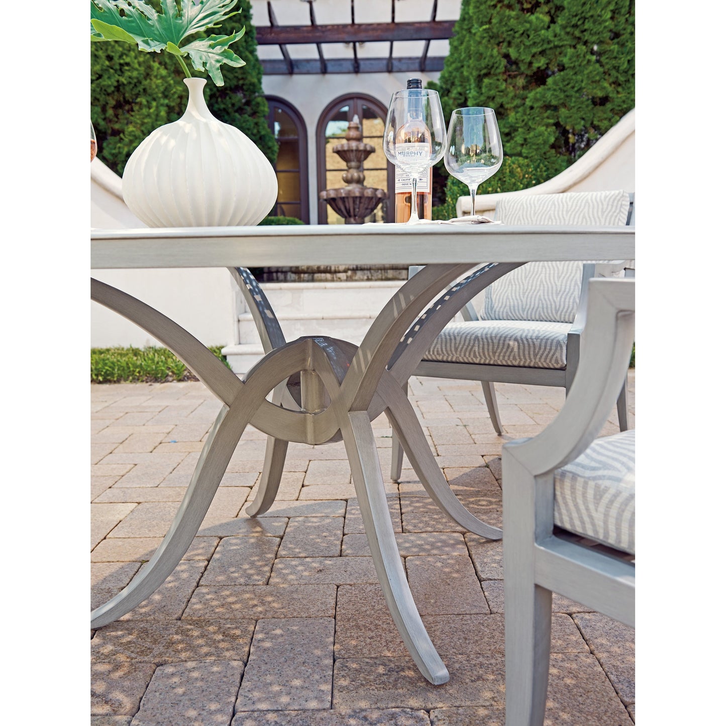 005 SI-1770911 | Lifestyle | Silver Sands Dining Table by Tommy Bahama Outdoor in gray oyster shell. Made from unique in a transitional style.