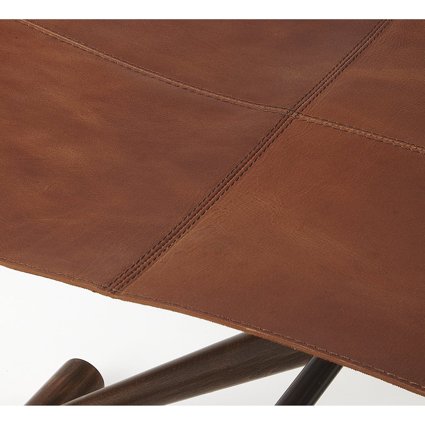 004 S-346382 | Additional Silo | Sutton Leather Folding Stool by Butler Specialty Company in medium brown and butler loft. Made from natural leather, shorea, meranti wood solids in a rustic style.