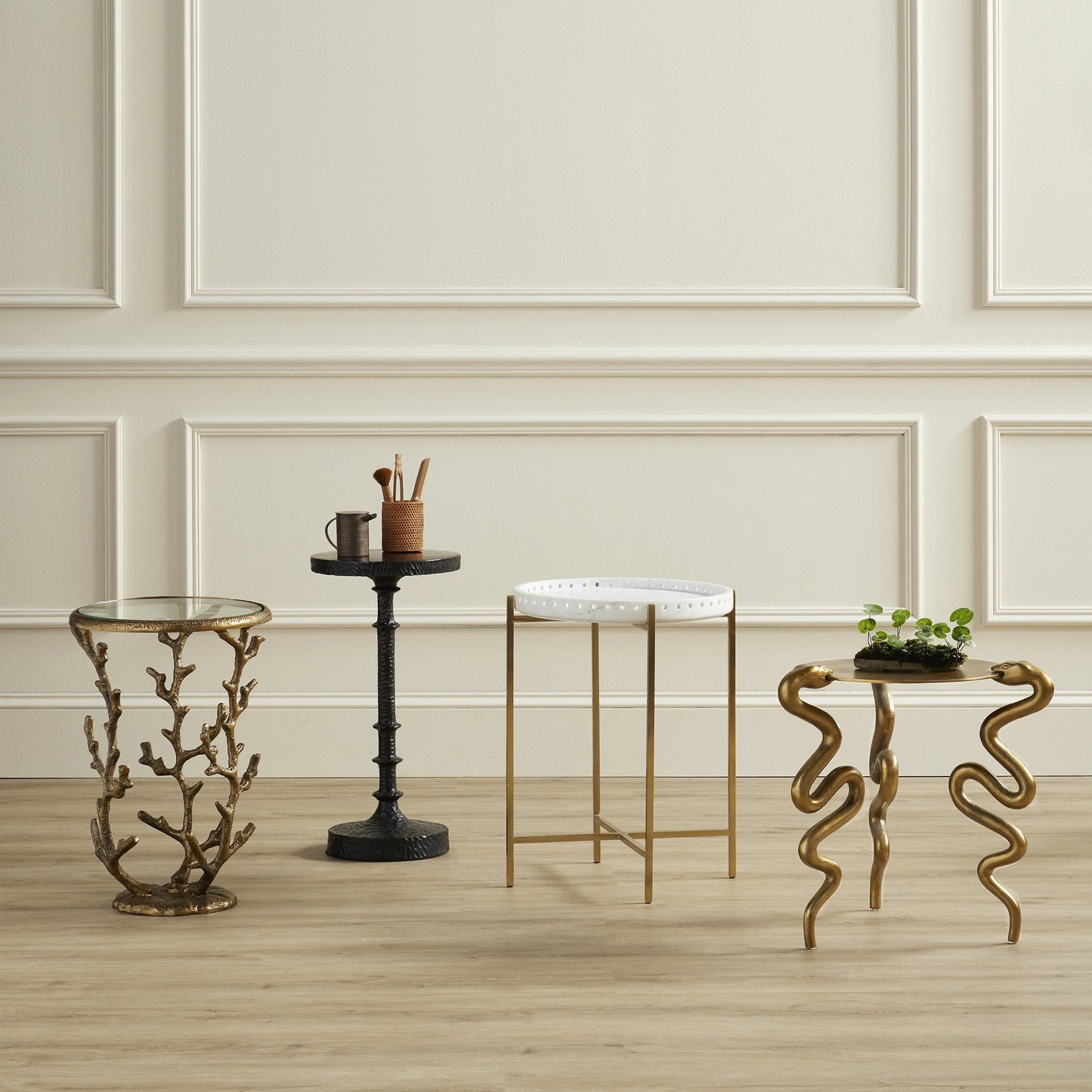 004 SI-1924175 | Lifestyle | Serpent Accent Table by Currey and Company in antique brass. Made from cast aluminum in a modern style.