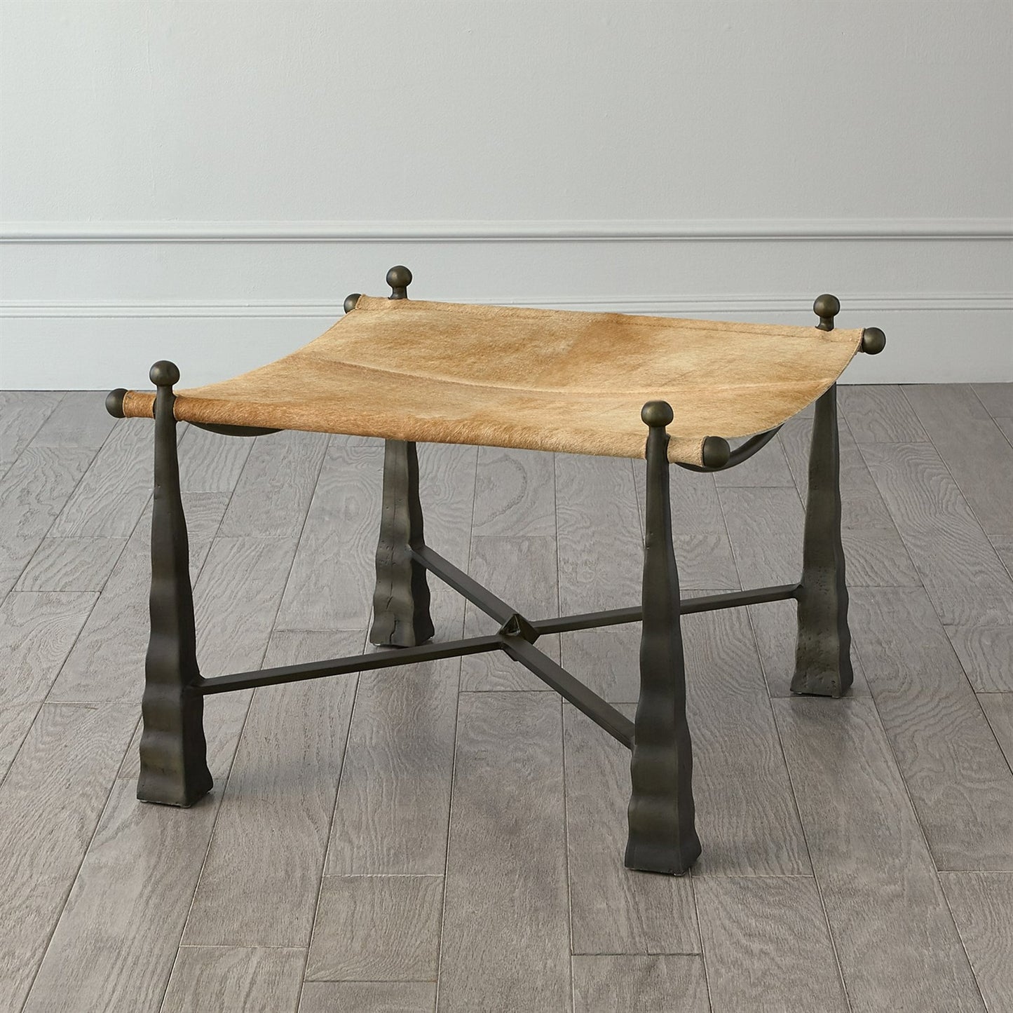 003 SR-890550 | Lifestyle | Cognac Ottoman by Global Views. Made from metal, cowhide in a rustic style.