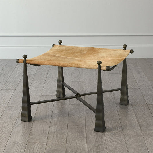 Cognac Ottoman by Global Views. Made from metal, cowhide in a rustic style.