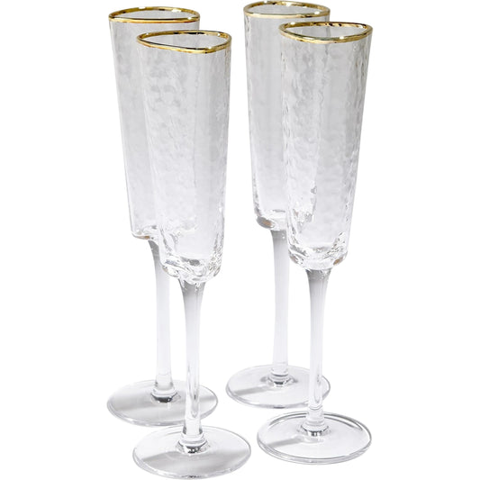 Hammered Champagne Glasses by Global Views in clear w, gold rim. Made from glass in a transitional style.