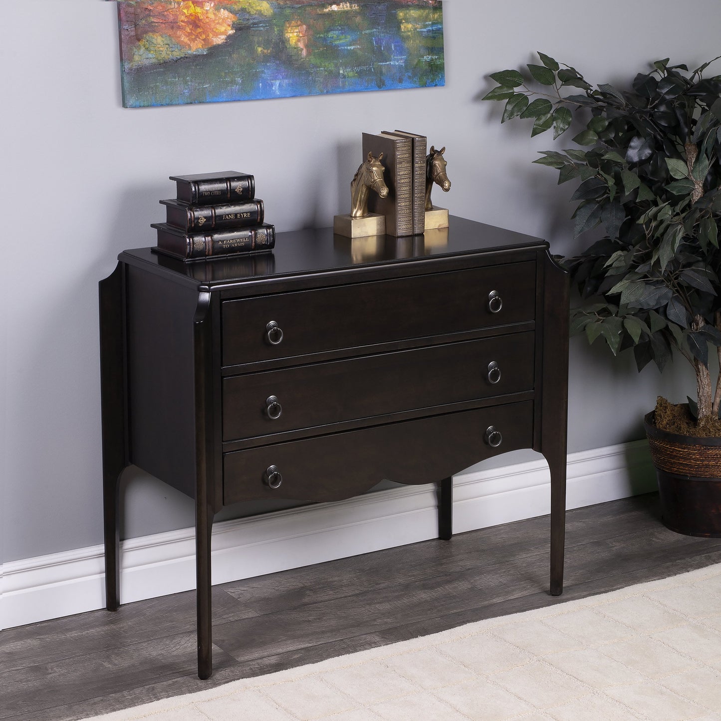 008 SR-770528 | Lifestyle | Wilshire Chest by Butler Specialty Company in dark brown and chocolate. Made from rubberwood solids, mdf, oak veneers, antique bronze finish hardware in a transitional style.